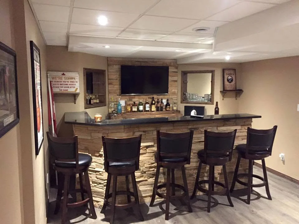 Completed basement bar with stone facing